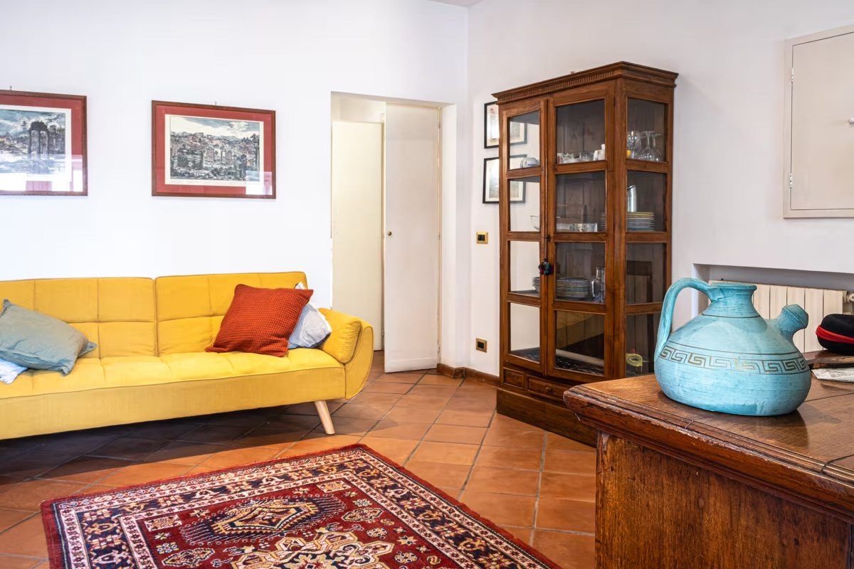 La Casa di G — Living room with sofa and cabinet