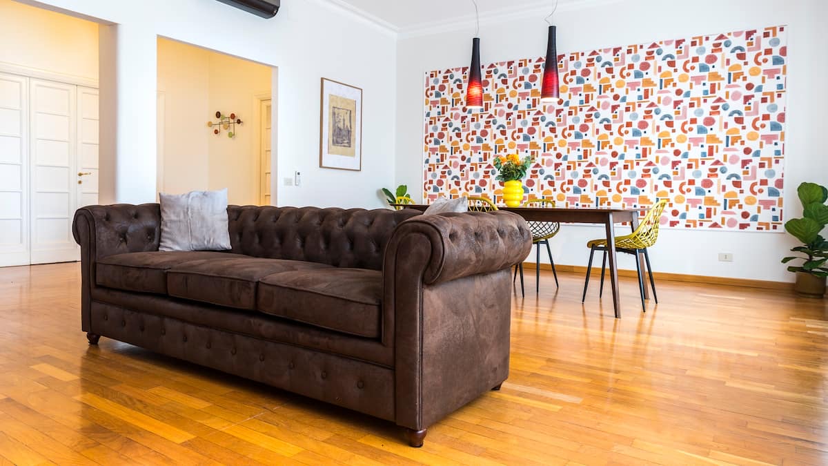V3 Flaminio Boutique – Open living and dining area with parquet floors
